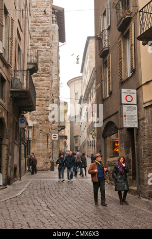 People walking through streets in Bergamo Italy Stock Photo