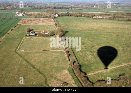 Shadow of a Virgin hot air balloon cast over the countryside of South Norfolk, UK Stock Photo