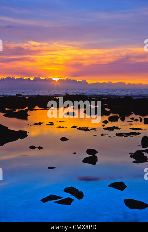 Sunset at the Pacific with lava in the foreground - The Big Island, Hawaii Stock Photo