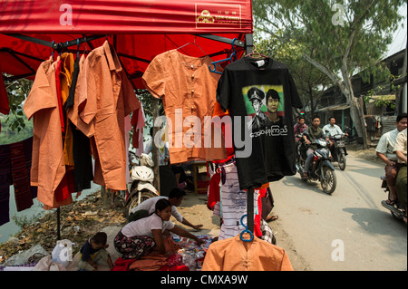 Vendor selling t-shirts and souvenirs raising money for the National League for Democracy  (NLD) in Mandalay Stock Photo