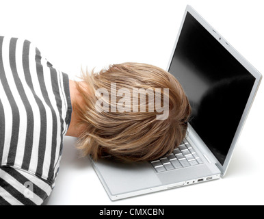 A man sleeping on his laptop Stock Photo