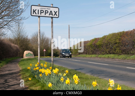 Kippax metal and stone road signs in spring Stock Photo