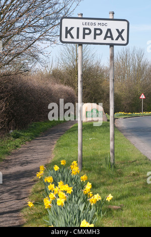 Kippax metal and stone road signs in spring Stock Photo