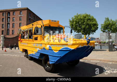 The yellow duckmarine at Albert Dock Liverpool gives amphibious tours of the docks and waterfront Stock Photo