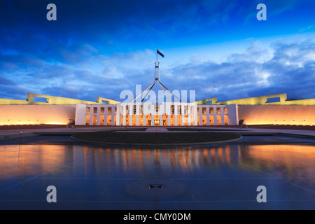 Dramatic evening sky over Parliament House, Canberra, Australia, illuminated at twilight. Stock Photo