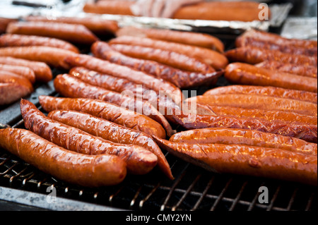 Closeup of tasty jumbo bratwurst on a grill. Stock Photo
