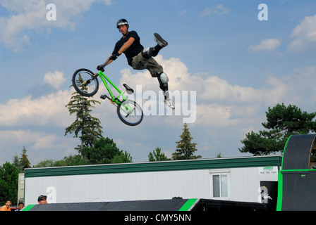 Extreme Stunt rider flying high in the air at the SuperEX in Ottawa Stock Photo