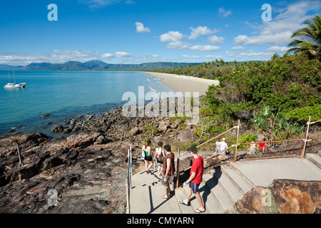 Tourists walking down coastal path to Four Mile Beach. Port Douglas, Queensland, Australia Stock Photo