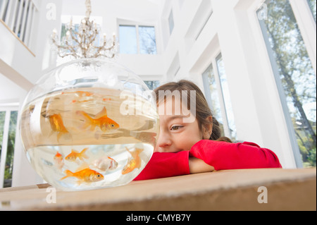 Germany, Bavaria, Grobenzell, Girl with goldfish bowl, smiling Stock Photo