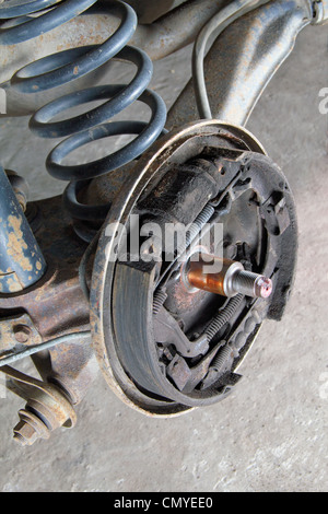 Old brake pads and cylinder brake drum Stock Photo