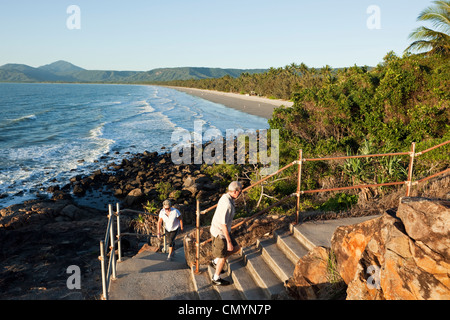 Tourists walking coastal path at Four Mile Beach. Port Douglas, Queensland, Australia Stock Photo