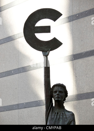 Bronze statue woman goddess Europa holding up Euro currency symbol in front of the European Parliament, Brussels, Belgium Stock Photo