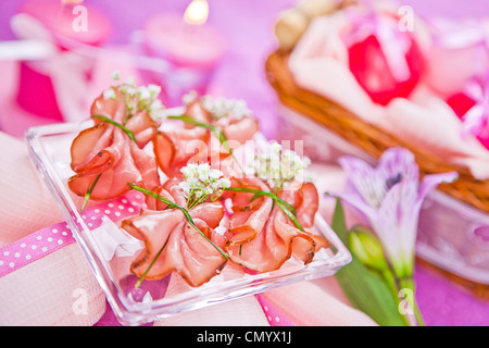 decorated piece of ham on the table Stock Photo