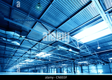 Empty warehouse toned in the blue color Stock Photo
