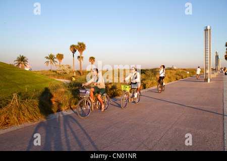 Miami Beach Florida,South Pointe Park,Point,turtle light towers,DecoBike Citi Bike CitiBike rental bikes,man men male,woman female women,FL120114010 Stock Photo