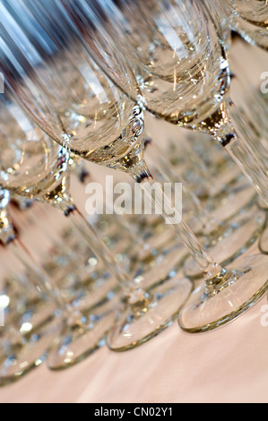 Detail of several rows of wine glasses on a table Stock Photo