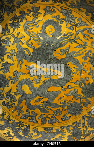 Dragon painted on vintage plate Stock Photo