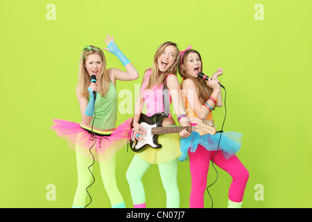 girl band, group of girls singing and playing guitar Stock Photo