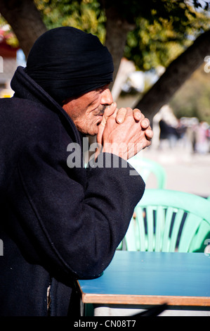 An old Arabic man who thinks, Feriana Tunisia Stock Photo