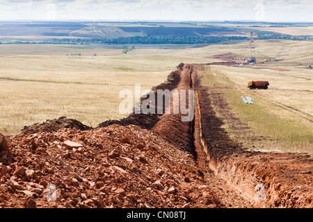 The trench for laying oil pipes in the oil field in Russia Stock Photo