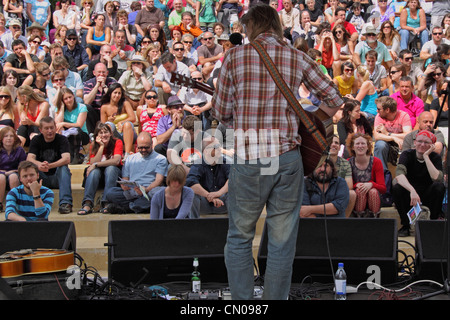 Guitarist performing on the Cascade Steps stage at the Bristol Harbour Festival, the largest free event of its kind in Europe Stock Photo