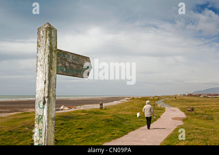 UK, Cumbria, Barrow in Furness, Walney Island, wooden public footpath sign post to Sandy Gap Stock Photo