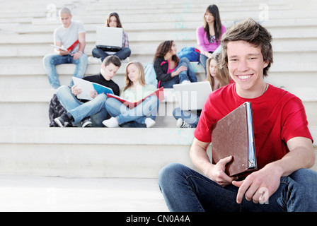 diverse group of students working outdoors Stock Photo