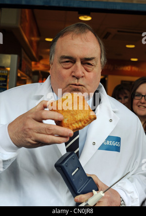 Former Deputy Prime Minister John Prescott tries out a hot pasty during a visit to Greggs the Bakers in Brighton Sussex UK . Stock Photo