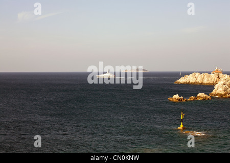 Motor yacht sailing out of Dubrovnik past Lapad into The Adriatic Dalmatia Croatia Stock Photo