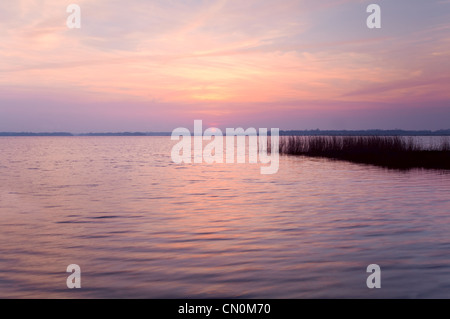 soft pink sunset over big lake Stock Photo