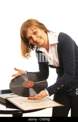 Woman presents old gramophone plate Stock Photo