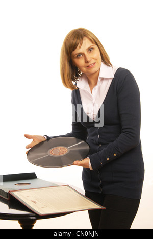 Women presents old gramophone plate Stock Photo