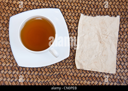 Tea and blank paper on sedge background Stock Photo