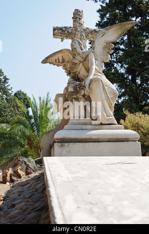 Tomb decorated with statues and sculptures in the monumental cemetery of Montjuic - Barcelona, Spain. Stock Photo
