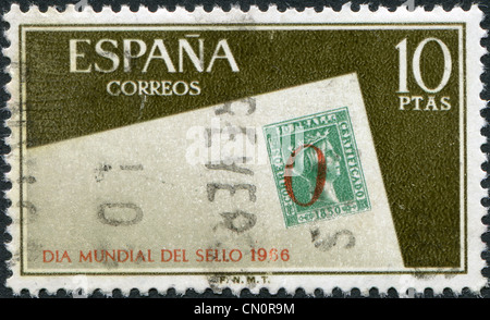 A stamp printed in Spain, shows an envelope with postage stamp of Spain and the № 5 postmark of Alicante, circa 1966 Stock Photo