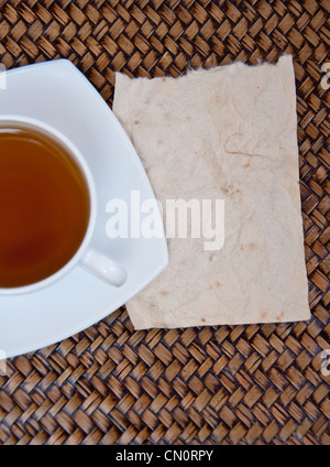 Tea and blank paper on sedge background Stock Photo