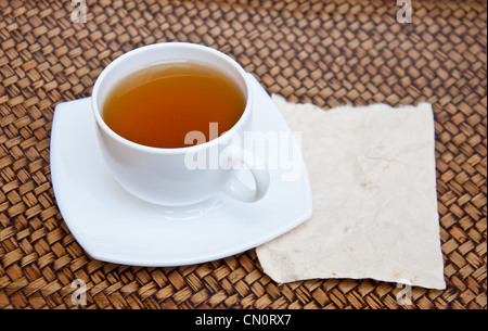 Tea and blank paper on sedge background Stock Photo