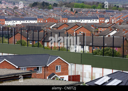 the peace line wall separating the lower falls and shankill areas of west Belfast Northern Ireland UK Stock Photo