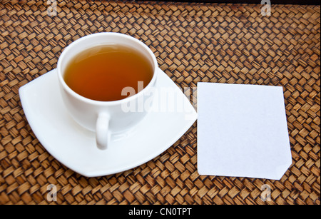 Tea and blank paper on sedge background Stock Photo