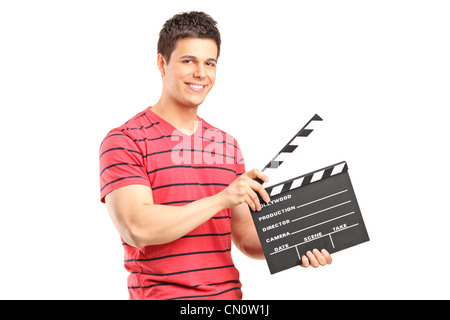 Young movie director holding a movie clap, isolated on white Stock Photo