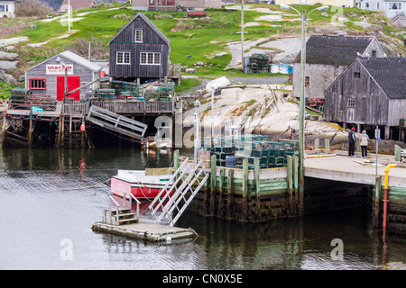 Peggy's Cove fishing village (and tourist attraction) on a cold, rainy day in May, at Nova Scotia, Canada. Stock Photo