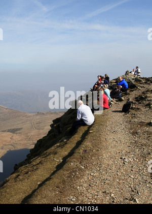 People resting on the summit of Helvellyn NW England UK Stock Photo