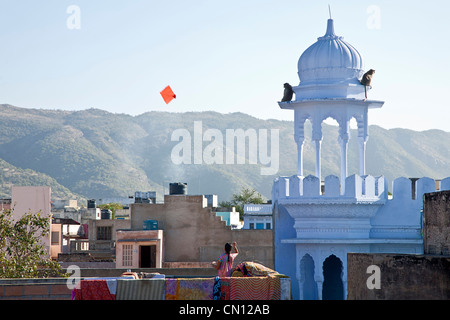 Woman flying a kite. Pushkar. Rajasthan. India Stock Photo