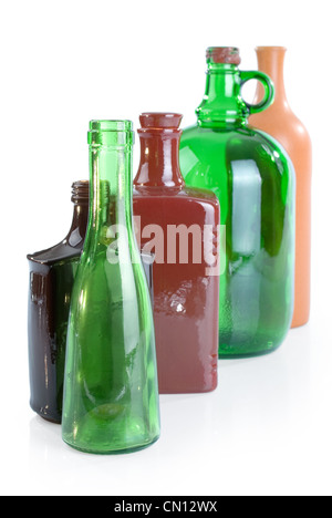 five empty bottles isolated on white background Stock Photo - Alamy