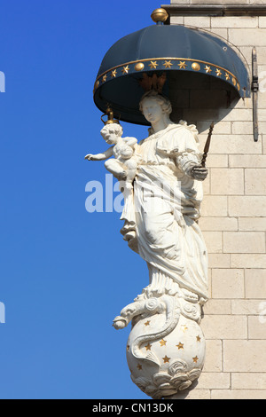 Statue of Madonna with child on a corner of the Market Place in Antwerp, Belgium Stock Photo