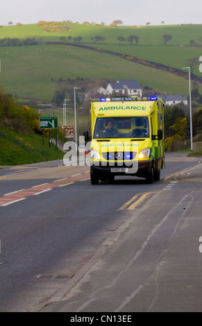Ambulance with flashing blue lights responding to a medical emergency Stock Photo