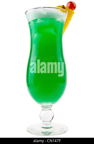 A delicious green cocktail with slices of fresh pineapple and a cherry on top Stock Photo