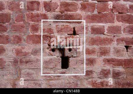 Bullet mark inside the Jallianwala Bagh, outlined by a white rectangle. The site is a memorial for a massacre done in 1919 Stock Photo