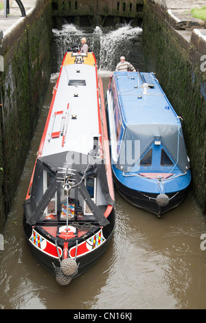 barges on The Leeds and Liverpool Canal, Bingley, West Yorkshire, Great Britain at five rise locks Stock Photo