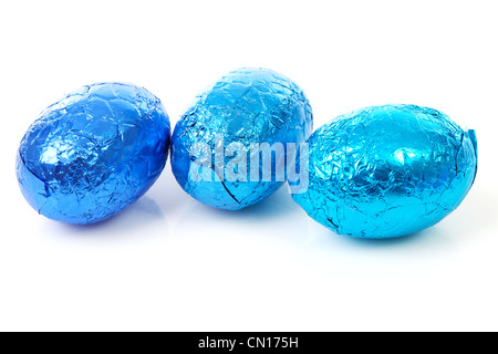 Three blue chocolate easter eggs over white background Stock Photo